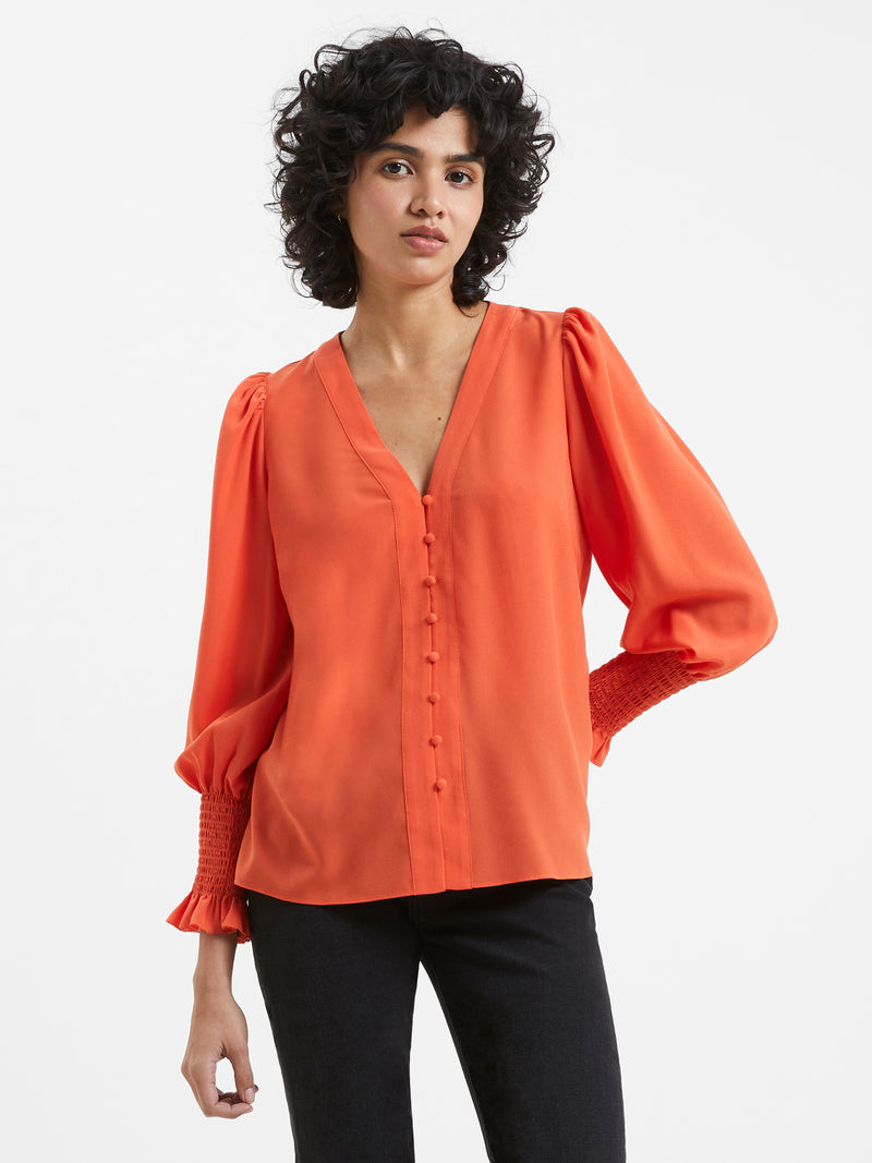 Orange smocked top sales