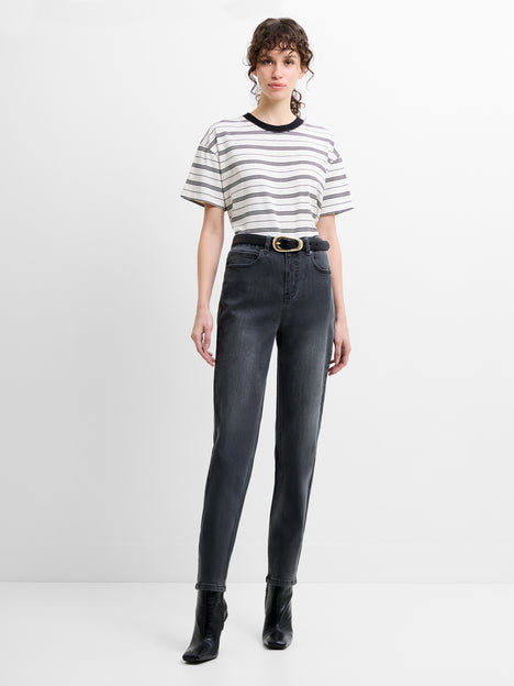 Woman wearing a striped T-shirt with dark grey, slim straight leg jeans with a high waisted fit