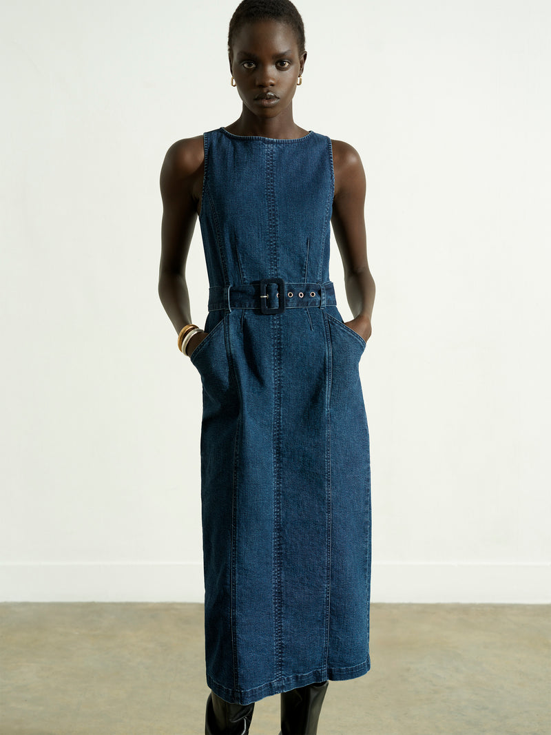 Woman wearing a blue belted denim midi dress 